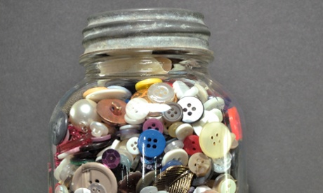 Vintage clothing buttons in a glass jar