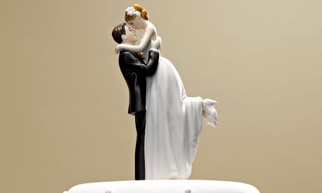 Bride and groom topper on wedding cake