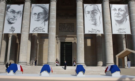 Francois Hollande (centre) stands on the Pantheon steps between the flag-draped coffins of Jean Zay, Genevieve de Gaulle-Anthonioz, Pierre Brossolette and Germaine Tillion.
