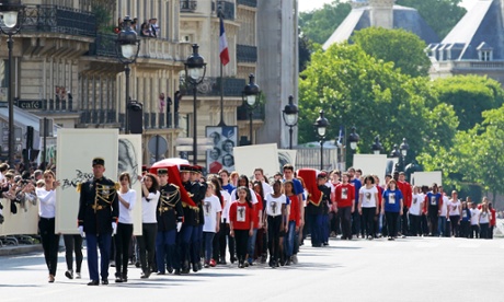Republican guards carry the caskets towards the Pantheon on Wednesday.
