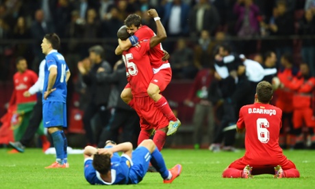 Coke celebrates Sevilla's victory with Stephane Mbia.