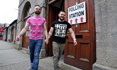 A gay couple holding hands after voting in Ireland's referendum on same-sex marriage