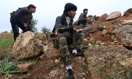 Fighters from the Al-Nusra Front fight against forces loyal to Assad  outside Aleppo.