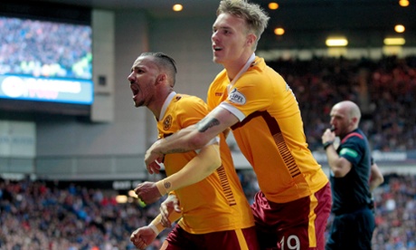 Lionel Ainsworth celebrates with Lee Erwin after scoring the third goal for Motherwell.