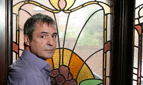 Actor Neil Morrissey in front of a stained glass window