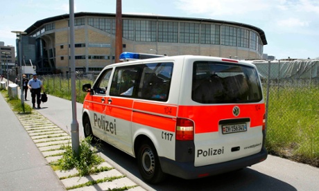 A police car leaves the Hallenstadion.