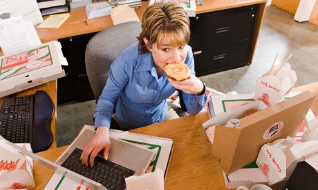 Office worker eating at desk