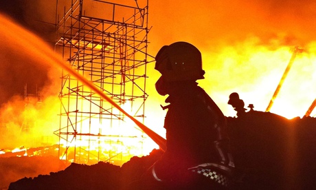 A firefighter tackling a fire at Nottingham University in September 2014