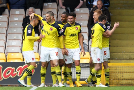 Fleetwood's Mark Roberts celebrates scoring their second goal.