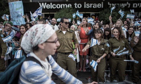 An immigrant from the United States is cheered by a crowd after arriving at the Ben Gurion airport, outside Tel Aviv, in July 2013