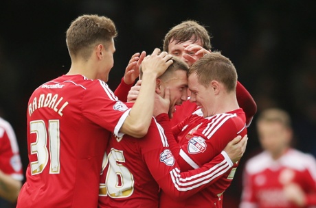 Anton Rodgers of celebrates with team mates after scoring their first.