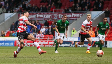 Nathan Tyson scores their fourth goal from the penalty spot.