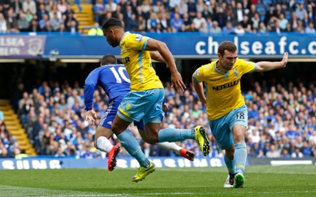 Eden Hazard is brought down in the area by James McArthur.
