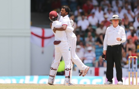 Veerasammy Permaul celebrates with Denesh Ramdin the wicket of Ben Stokes.