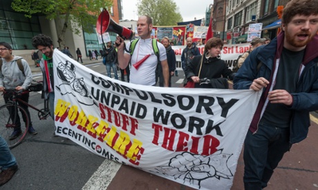 A banner protesting against workfare.