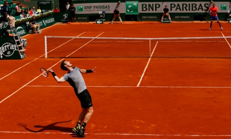 Andy Murray serves to Nick Kyrgios during their French Open clash.