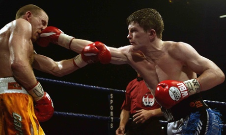 Eamonn Magee (left) takes a punch from Ricky Hatton during the WBU Light-Welterweight World Championship fight in June 2002 in Manchester.