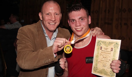 Eamonn Magee Jnr, who has been stabbed to death, pictured with his father.