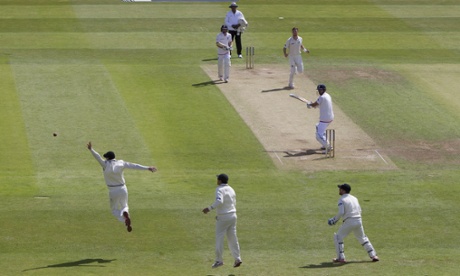 England's captain Alastair Cook, centre right, is nearly caught as he reaches 50 off the bowling of Matt Henry.
