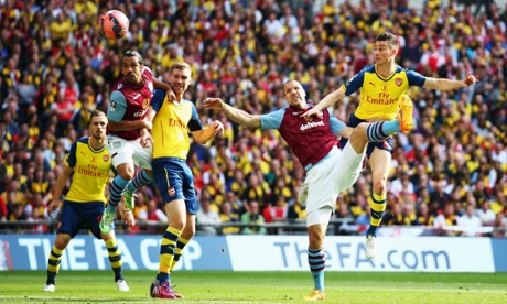 Laurent Koscielny fires a header towards the Villa goal but is denied by smart save from Shay Given.