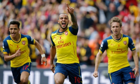 Theo Walcott of Arsenal celebrates after scoring his side's first goal during the FA Cup final against Aston Villa.