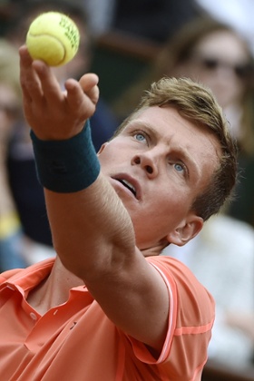 Tomas Berdych serves.