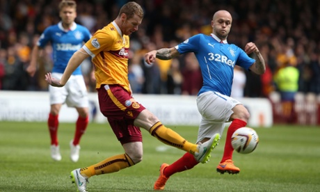 Motherwell's Stephen Pearson challenges Rangers' Nicky Law.