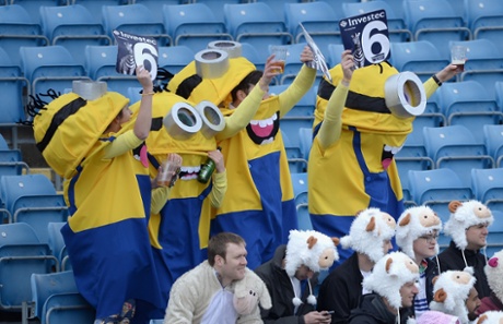 Fancy dressers cheer a six.