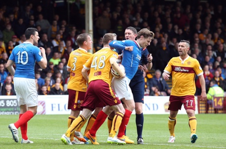 Stephen Pearson clashes with Marius Zaliukas.