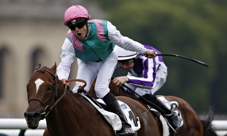 Vincent Cheminaud reacts after his mount New Bay wins the Prix du Jockey Club at Chantilly