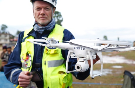 Workers of the British NGO Serve On, working with the Department for International Development, use a drone in the town of Chautara, Nepal, badly affected by the earthquake.