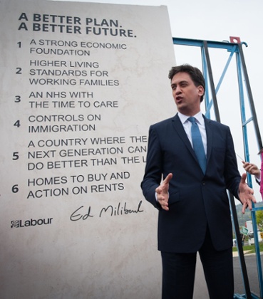 Ed Miliband unveils Labour's pledges carved into a stone plinth in Hastings.
