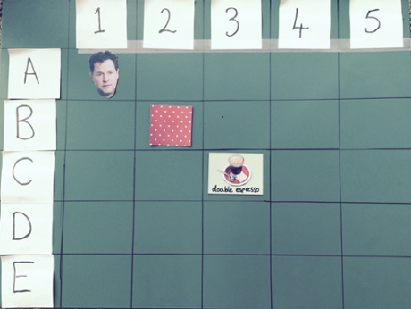 Nick lives next to the polka dot house and the person in the centre house drinks double espresso.