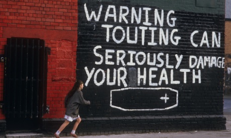 A mural on the corner of Falls Road, west Belfast, with an IRA warning for informers, in 1985.
