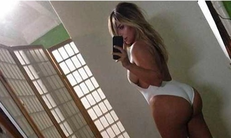 Kim Kardashian takes a selfie of her behind.