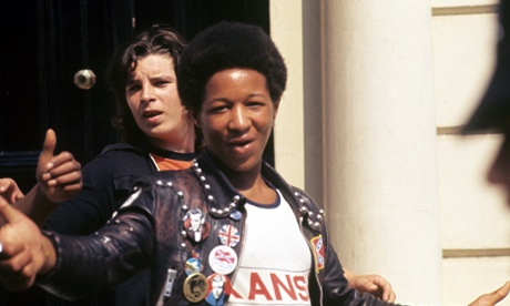 Teenager wearing studded leather jacket with badges on Kings Road, London, 1977.