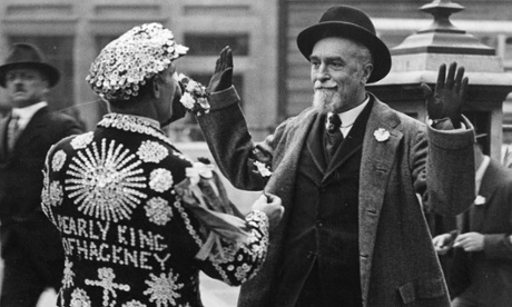 Montagu Collet Norman, Governor of the Bank of England, surrenders to the Pearly King of Hackney who is selling flags for charity outside the Bank of England, London, 1933.