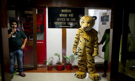  Greenpeace activists protest outside the office of the Indian coal minister demanding a halt in allocation of forest land for coal mining, in New Delhi, India, Sept 2012