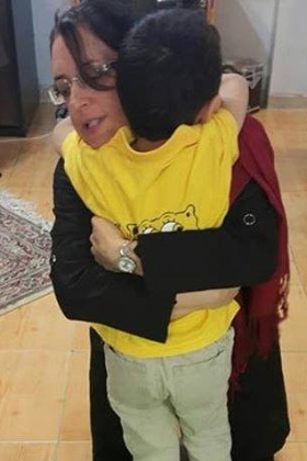 Faran Hesami embraces her son before returning to prison after a four-day leave this March. She is a Bahá’í