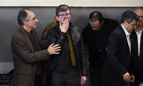 Editor-in-chief of French satirical weekly Charlie Hebdo Gerard Briard (l) lookis on as French cartoonist Renald Luzier, aka Luz, blows a kiss.