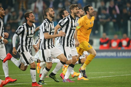 Juventus' goalkeeper and captain Gianluigi Buffon celebrates with teammates after winning 2-1.
