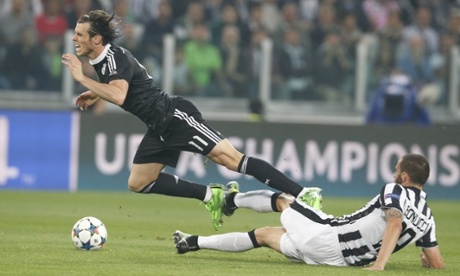 Real Madrid's Gareth Bale, left, is tackled by Juventus' Leonardo Bonucci
