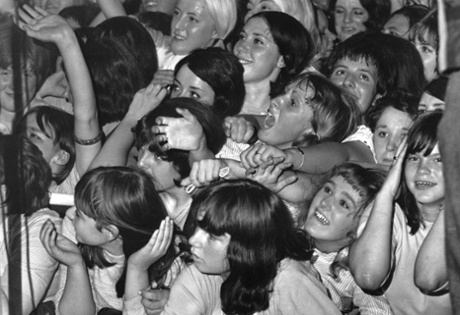 14th August 1964:  Rolling Stones fans watching the band in concert at the Wimbledon Palais, London.  