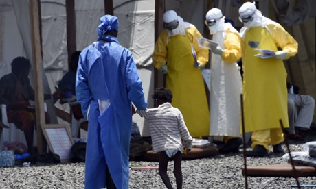Health workers in protective suits at Ebola clinic in west Africa