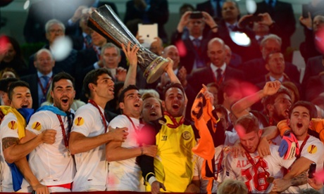 Ivan Rakitic of Sevilla lifts the Europa League trophy  after their win over Benfica at the Juventus Stadium last year.