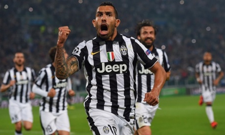 Carlos Tevez celebrates as he scores their second goal from a penalty.