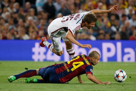 Muller is fouled by Mascherano.