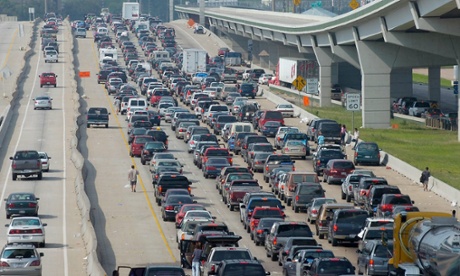 Cars sit in slow-moving traffic.