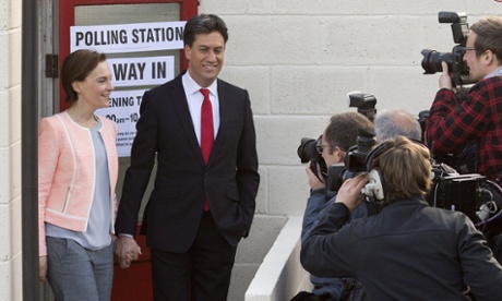 Ed Miliband arrives to vote with his wife Justine on 7 May 2015.