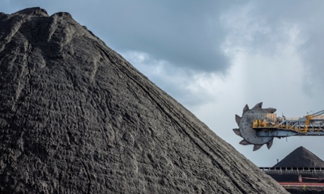 An automated bucket-wheel excavator loads coal into ships
